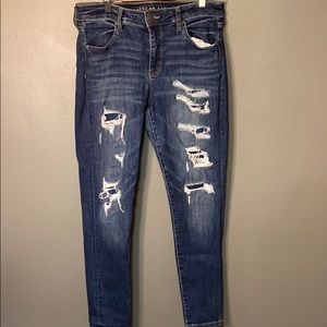 Fake distressed blue jeans